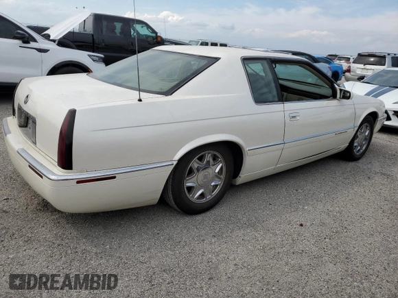 1999 Cadillac Eldorado z VIN 1G6EL12Y7XU615169, wystawiony jako Copart lot #76459744 z przebiegiem Nie podano mil oraz Szkoda całkowita • Salvage title. Historia ofert i sprzedaży dostępna na DreamBid. Obrazek 3.