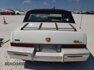 1991 Cadillac Seville z VIN 1G6KS53B9MU824142, wystawiony jako Copart lot #74276264 z przebiegiem 103 517 mil mil oraz Szkody całkowita. Historia ofert i sprzedaży dostępna na DreamBid. Obrazek 6.