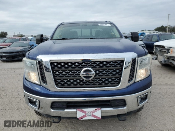2017 Nissan Titan SL z VIN 1N6BA1F25HN514572, wystawiony jako Copart lot #85803054 z przebiegiem 79 904 mil mil oraz Czysty tytuł • Clean title. Historia ofert i sprzedaży dostępna na DreamBid. Obrazek 5.
