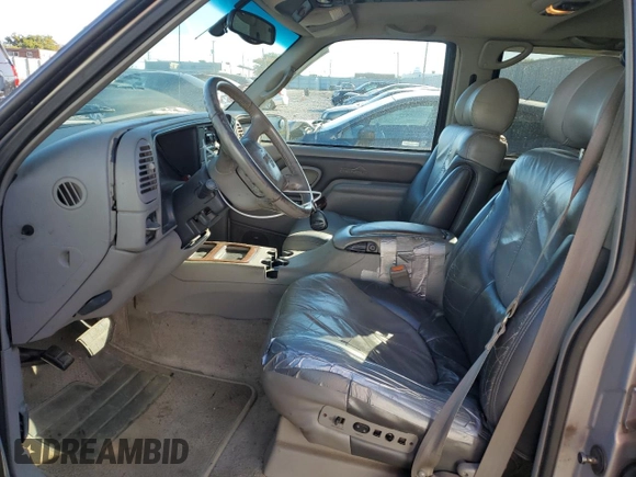 1999 GMC Denali z VIN 1GKEK13R4XR918005, wystawiony jako Copart lot #74964184 z przebiegiem 206 584 mil mil oraz Nie do naprawy. Historia ofert i sprzedaży dostępna na DreamBid. Obrazek 7.