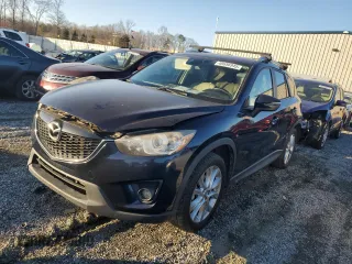 2015 Mazda CX-5 Grand Touring with VIN JM3KE2DY6F0511329, listed as a Copart auction lot 48656945 with 203,540 mi miles and Salvage Title. Bid and sale history available at carsss.com. Image 1.