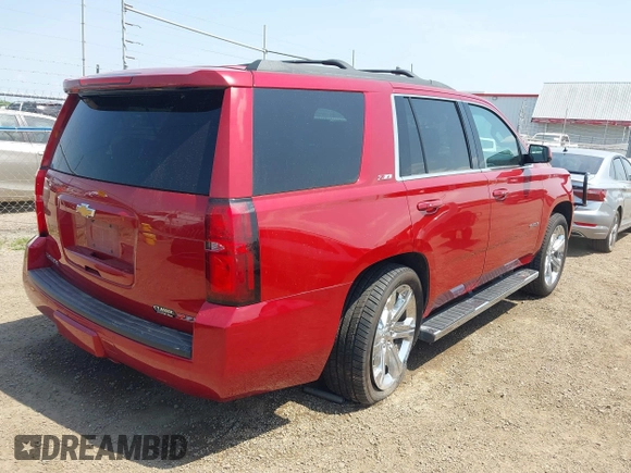 2015 Chevrolet Tahoe LT with VIN 1GNSKBKC6FR628355, listed as a IAAI auction lot 42159743 with 95,730 mi miles and . Bid and sale history available at DreamBid. Image 4.