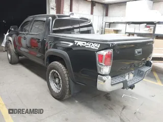 2021 Toyota Tacoma SR with VIN 3TMCZ5AN4MM448304, listed as a IAAI auction lot 42046932 with 56,161 mi miles and . Bid and sale history available at DreamBid. Image 3.