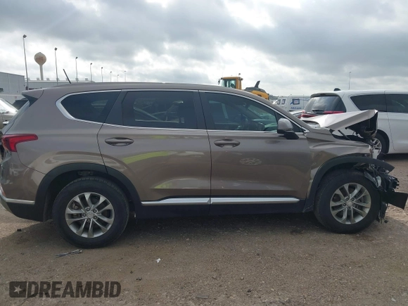 2019 Hyundai Santa Fe SE z VIN 5NMS23AD2KH014037, wystawiony jako IAAI lot #42110778 z przebiegiem 48 975 mil mil oraz . Historia ofert i sprzedaży dostępna na DreamBid. Obrazek 14.