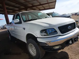 1999 Ford F-150 XL with VIN 2FTRX18L9XCA21004, listed as a IAAI auction lot 41616300 with 186,620 mi miles. Bid and sale history available at carsss.com. Image 1.