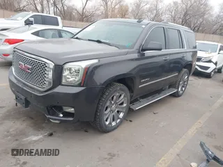 2015 GMC Yukon Denali with VIN 1GKS2CKJ2FR705806, listed as a IAAI auction lot 41568322 with 171,011 mi miles. Bid and sale history available at carsss.com. Image 2.