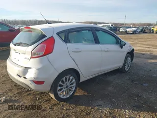 2017 Ford Fiesta Titanium with VIN 3FADP4FJ8HM112435, listed as a IAAI auction lot 41005143 with 75,144 mi miles and . Bid and sale history available at DreamBid. Image 4.