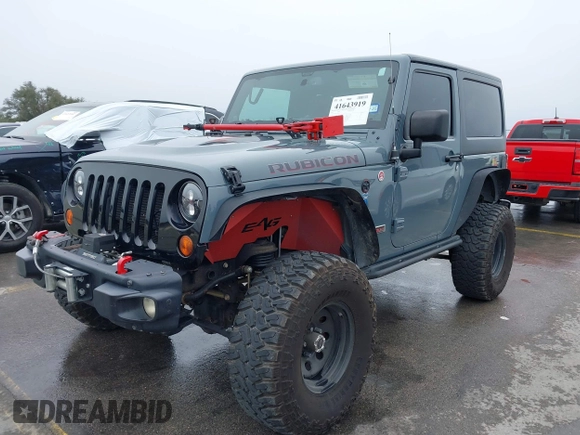 2013 Jeep Wrangler Rubicon 10th Anniversary with VIN 1C4BJWCG2DL651815, listed as a IAAI auction lot 41643919 with 98,297 mi miles and . Bid and sale history available at DreamBid. Image 17.