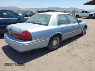 2000 Mercury Grand Marquis LS z VIN 2MEFM75W8YX660478, wystawiony jako IAAI lot #42289748 z przebiegiem 237 860 mil mil oraz . Historia ofert i sprzedaży dostępna na DreamBid. Obrazek 4.