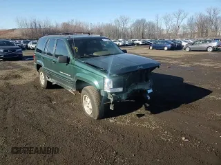 1998 Jeep Grand Cherokee Laredo with VIN 1J4GZ48S4WC239246, listed as a Copart auction lot 86101204 with 0 mi miles and Salvage Title. Bid and sale history available at carsss.com. Image 12.