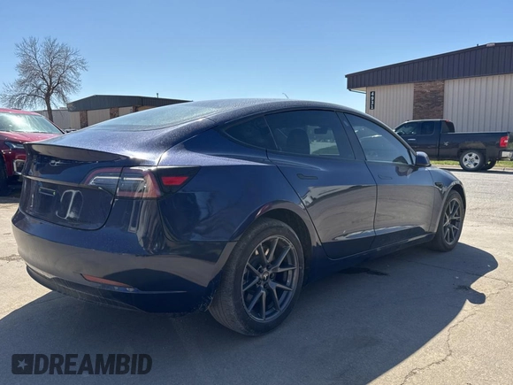 2023 Tesla Model 3 Long Range with VIN 5YJ3E1EB1PF625677, listed as a Copart auction lot 52424245 with 12,817 mi miles and Salvage Title. Bid and sale history available at DreamBid. Image 4.