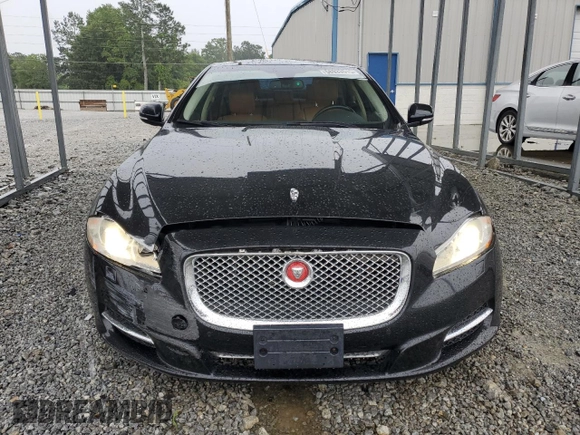 2014 Jaguar XJ Portfolio with VIN SAJWJ2GD5E8V69982, listed as a Copart auction lot 58933515 with 92,847 mi miles and Salvage title. Bid and sale history available at DreamBid. Image 5.