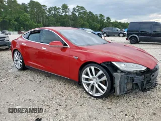 2014 Tesla Model S 60 with VIN 5YJSA1H11EFP43669, listed as a Copart auction lot 62368605 with Not provided miles and Salvage title. Bid and sale history available at DreamBid. Image 4.