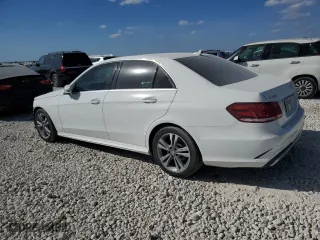 2015 Mercedes-Benz E-Class E 250 BlueTEC Luxury with VIN WDDHF0EB8FB157452, listed as a Copart auction lot 74910084 with 121,993 mi miles and Salvage Title. Bid and sale history available at carsss.com. Image 2.
