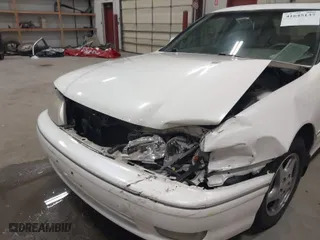 1999 Toyota Avalon XL with VIN 4T1BF18B2XU293904, listed as a IAAI auction lot 41645137 with NaN miles. Bid and sale history available at carsss.com. Image 6.