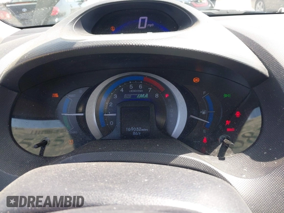 2010 Honda Insight LX with VIN JHMZE2H50AS014165, listed as a IAAI auction lot 42381535 with 169,032 mi miles and . Bid and sale history available at DreamBid. Image 7.