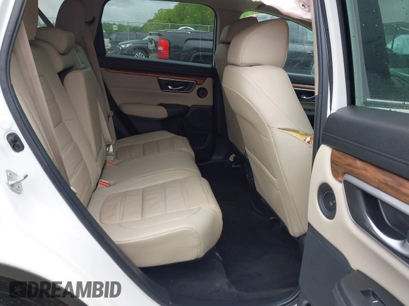 2018 Honda CR-V Touring z VIN 5J6RW1H96JL014087, wystawiony jako IAAI lot #41931640 z przebiegiem Nie podano mil oraz . Historia ofert i sprzedaży dostępna na DreamBid. Obrazek 8.