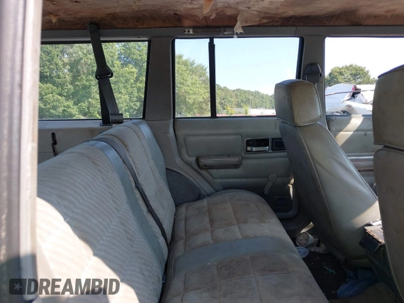 1990 Jeep Cherokee with VIN 1J4FJ38L1LL100497, listed as a IAAI auction lot 37253812 with 214,943 mi miles and . Bid and sale history available at DreamBid. Image 8.