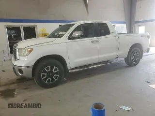 2011 Toyota Tundra with VIN 5TFRM5F17BX030017, listed as a Copart auction lot 61488205 with 214,966 mi miles and Salvage title. Bid and sale history available at DreamBid. Image 1.