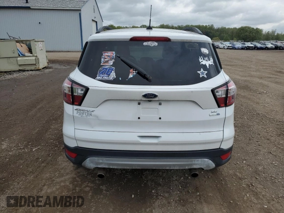 2018 Ford Escape SE z VIN 1FMCU9G97JUB48596, wystawiony jako Copart lot #56388505 z przebiegiem 96 996 mil mil oraz Czysty tytuł • Clean title. Historia ofert i sprzedaży dostępna na DreamBid. Obrazek 6.