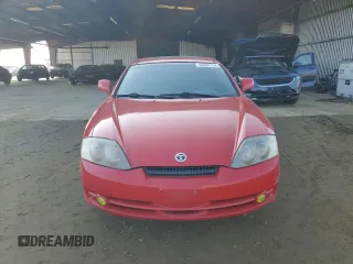 2003 Hyundai Tiburon GT z VIN KMHHN65F63U060104, wystawiony jako Copart lot #84560184 z przebiegiem 160 120 mil mil oraz Czysty tytuł • Clean title. Historia ofert i sprzedaży dostępna na DreamBid. Obrazek 5.