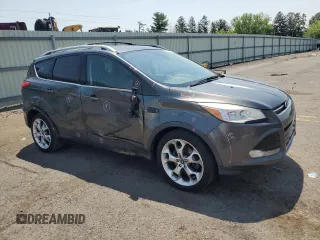 2015 Ford Escape Titanium z VIN 1FMCU9J97FUA38731, wystawiony jako Copart lot #60621085 z przebiegiem 119 704 mil mil oraz Szkoda całkowita • Salvage title. Historia ofert i sprzedaży dostępna na DreamBid. Obrazek 4.