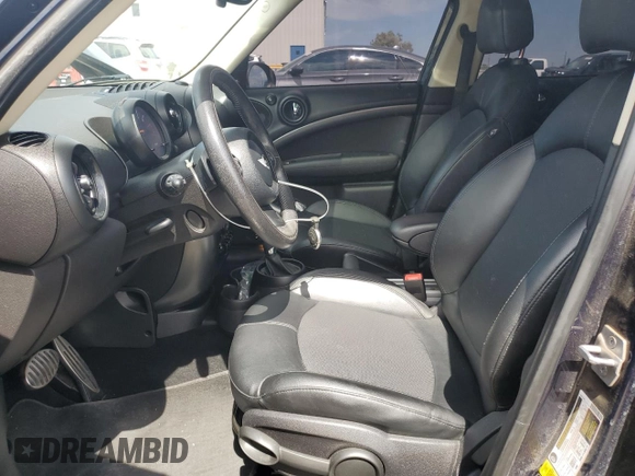 2016 MINI Countryman S with VIN WMWZC3C59GWT08439, listed as a Copart auction lot 65167955 with 76,336 mi miles and Salvage title. Bid and sale history available at DreamBid. Image 7.
