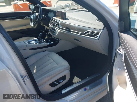 2019 BMW 7 Series 740i with VIN WBA7E2C53KB454816, listed as a IAAI auction lot 42539294 with 73,363 mi miles and . Bid and sale history available at DreamBid. Image 5.