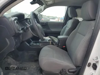 2023 Toyota Tacoma SR z VIN 3TYRX5GN7PT086579, wystawiony jako Copart lot #58221205 z przebiegiem 38 990 mil mil oraz Nie do naprawy • Non repairable. Historia ofert i sprzedaży dostępna na DreamBid. Obrazek 7.