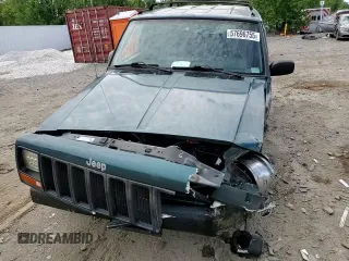 1998 Jeep Cherokee Sport z VIN 1J4FJ68S4WL101110, wystawiony jako Copart lot #57696755 z przebiegiem 218 254 mil mil oraz Szkoda całkowita • Salvage title. Historia ofert i sprzedaży dostępna na DreamBid. Obrazek 14.