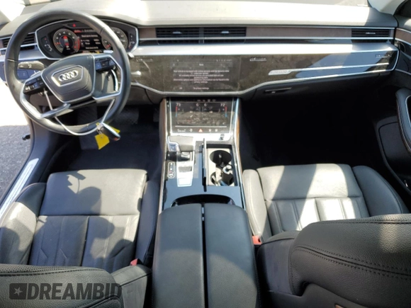 2022 Audi A8 with VIN WAULDAF86NN001617, listed as a Copart auction lot 63068504 with 25,974 mi miles and Salvage title. Bid and sale history available at DreamBid. Image 8.