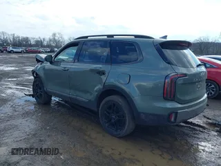 2023 Kia Telluride EX X-Line z VIN 5XYP3DGC8PG338845, wystawiony jako IAAI lot #41665367 z przebiegiem 63 595 mil mil oraz . Historia ofert i sprzedaży dostępna na DreamBid. Obrazek 3.