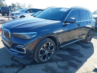 2021 BMW X5 sDrive40i with VIN 5UXCR4C08M9E15642, listed as a IAAI auction lot 41377524 with 76,050 mi miles. Bid and sale history available at carsss.com. Image 2.
