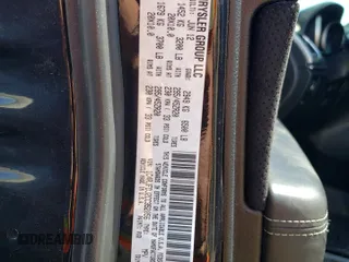 2012 Jeep Grand Cherokee SRT8 with VIN 1C4RJFDJ2CC352056, listed as a Copart auction lot 48810994 with 114,807 mi miles and Salvage Title. Bid and sale history available at carsss.com. Image 12.