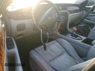 2004 Jaguar XJ with VIN SAJEA74C24SG09038, listed as a Copart auction lot 77015544 with Not Provided miles and Salvage Title. Bid and sale history available at DreamBid. Image 8.