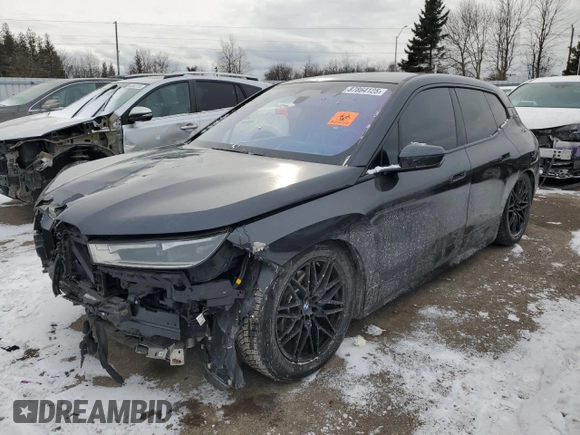 2022 BMW iX xDrive50 with VIN WB523CF05NCJ43021, listed as a Copart auction lot 87864125 with 28,976 mi miles and Salvage Title. Bid and sale history available at carsss.com. Image 1.
