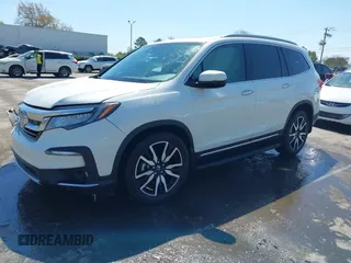 2019 Honda Pilot Touring 8-Passenger z VIN 5FNYF5H93KB021978, wystawiony jako IAAI lot #41915333 z przebiegiem 82 676 mil mil oraz . Historia ofert i sprzedaży dostępna na DreamBid. Obrazek 2.