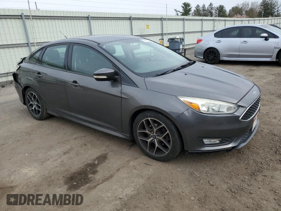 2015 Ford Focus SE with VIN 1FADP3F20FL267322, listed as a Copart auction lot 53678225 with 83,048 mi miles and Salvage Title. Bid and sale history available at DreamBid. Image 4.