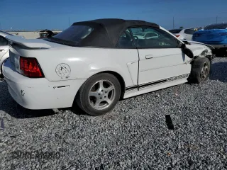 2002 Ford Mustang Deluxe with VIN 1FAFP44492F121223, listed as a Copart auction lot 62474065 with 128,984 mi miles and Salvage title. Bid and sale history available at DreamBid. Image 3.