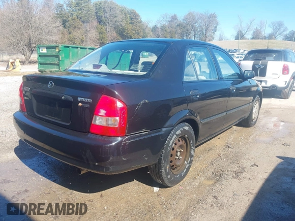 2000 Mazda Protege DX with VIN JM1BJ2227Y0303448, listed as a IAAI auction lot 41482747 with 206,542 mi miles and . Bid and sale history available at DreamBid. Image 4.