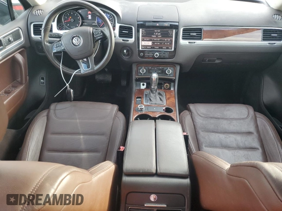 2012 Volkswagen Touareg Exec with VIN WVGEF9BP1CD011407, listed as a Copart auction lot 79199754 with 57,376 mi miles and Salvage Title. Bid and sale history available at DreamBid. Image 8.