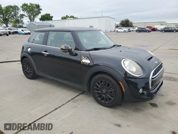 2014 MINI Hardtop S with VIN WMWXM7C57ET987069, listed as a Copart auction lot 52147955 with 121,276 mi miles and Salvage Title. Bid and sale history available at DreamBid. Image 4.