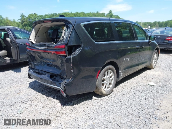 2023 Chrysler Pacifica Touring L with VIN 2C4RC1BG2PR534194, listed as a IAAI auction lot 42613934 with 69,896 mi miles and . Bid and sale history available at DreamBid. Image 4.