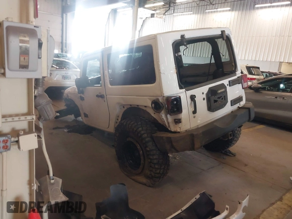 2012 Jeep Wrangler Arctic z VIN 1C4AJWBG9CL233232, wystawiony jako IAAI lot #42282805 z przebiegiem 109 927 mil mil oraz . Historia ofert i sprzedaży dostępna na DreamBid. Obrazek 3.
