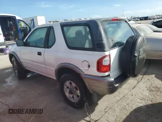 2001 Isuzu Rodeo z VIN 4S2CK57W614340766, wystawiony jako Copart lot #73891524 z przebiegiem 124 446 mil mil oraz Nie do naprawy. Historia ofert i sprzedaży dostępna na DreamBid. Obrazek 2.
