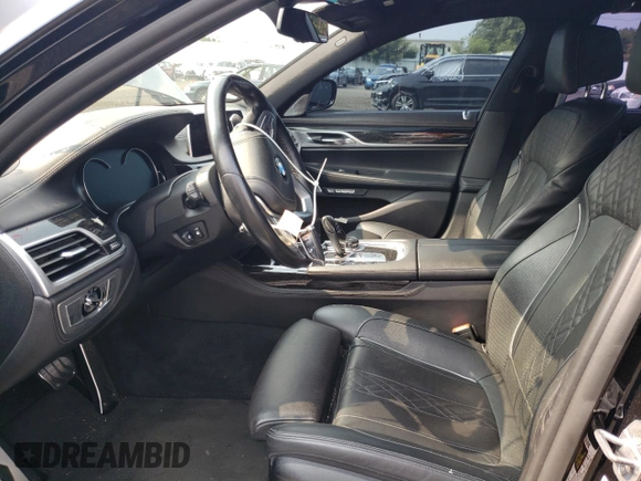 2018 BMW 7 Series 740e xDrive with VIN WBA7J2C57JG938291, listed as a Copart auction lot 58337763 with 53,259 mi miles and . Bid and sale history available at DreamBid. Image 7.