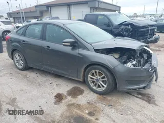 2016 Ford Focus SE z VIN 1FADP3F2XGL282170, wystawiony jako IAAI lot #42758530 z przebiegiem 63 951 mil mil oraz . Historia ofert i sprzedaży dostępna na DreamBid. Obrazek 1.