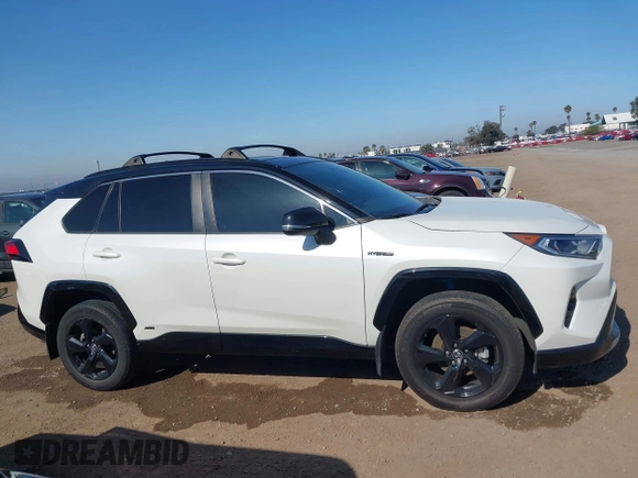 2021 Toyota RAV4 Hybrid XSE with VIN 4T3E6RFV3MU042773, listed as a IAAI auction lot 42000073 with 55,110 mi miles and . Bid and sale history available at DreamBid. Image 14.