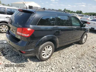 2015 Dodge Journey SXT with VIN 3C4PDCCG4FT697505, listed as a Copart auction lot 64888554 with 191,653 mi miles and Salvage title. Bid and sale history available at DreamBid. Image 3.