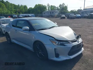 2014 Scion tC with VIN JTKJF5C78E3072572, listed as a IAAI auction lot 39680670 with 112,584 mi miles. Bid and sale history available at carsss.com. Image 1.